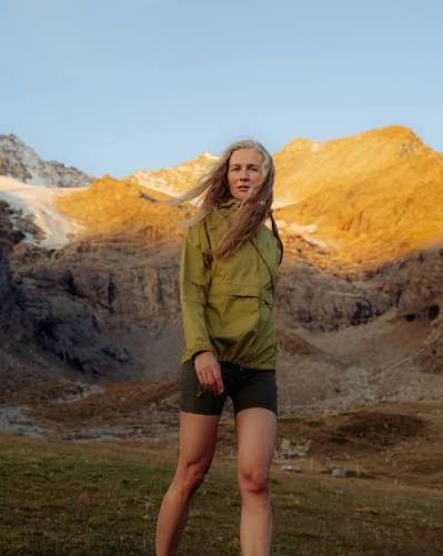An athlete wearing Odlo performance outerwear in the mountains.