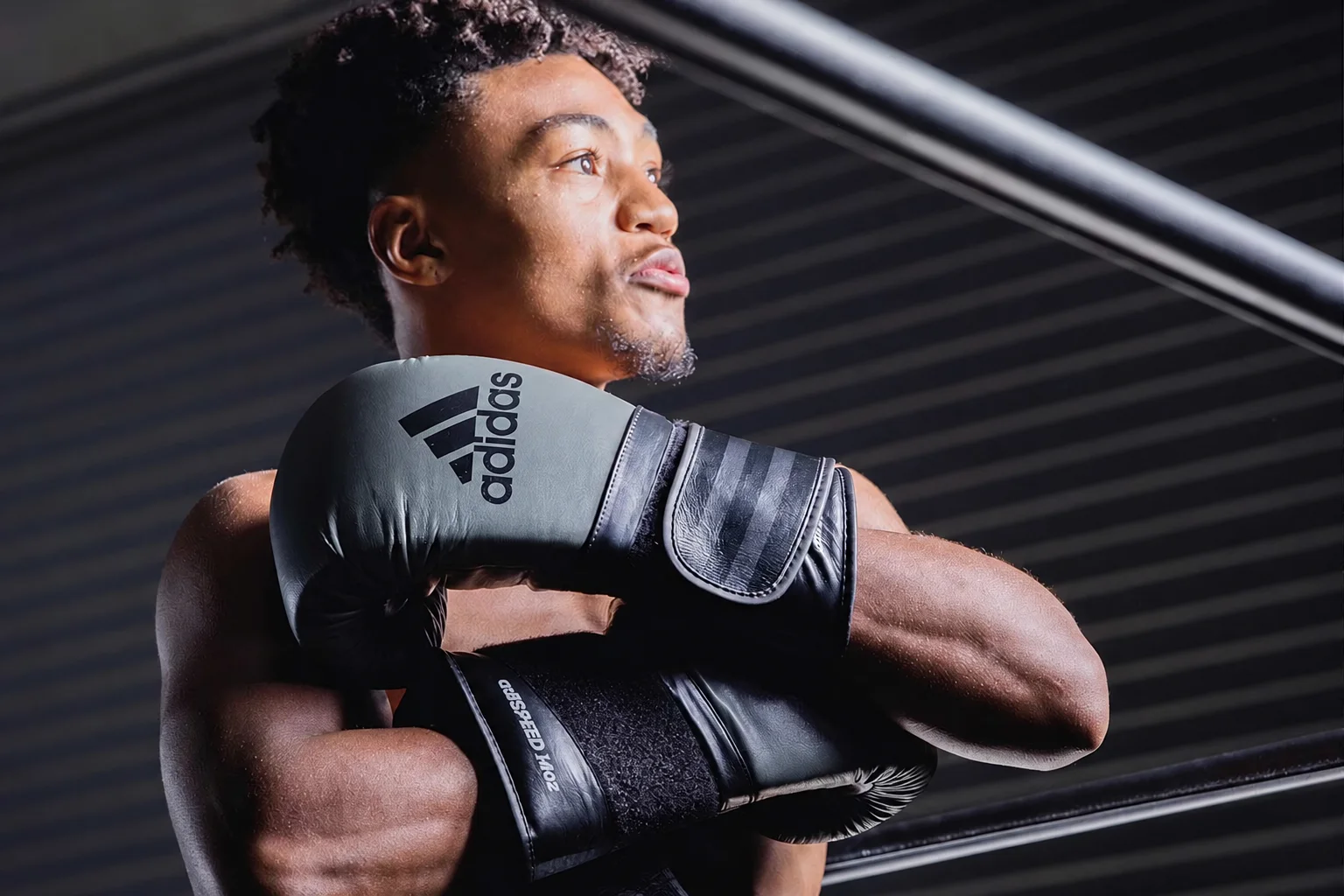 Boxer wearing Adidas Combat Sports gloves in a gym. Image courtesy of Adidas Combat Sports.