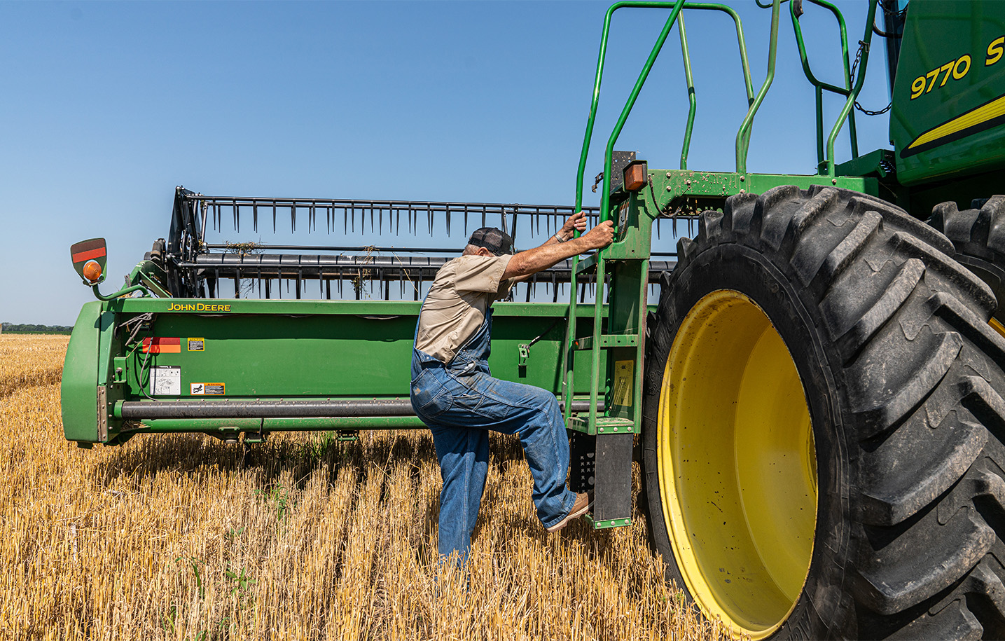 man on tractor wearing key overalls